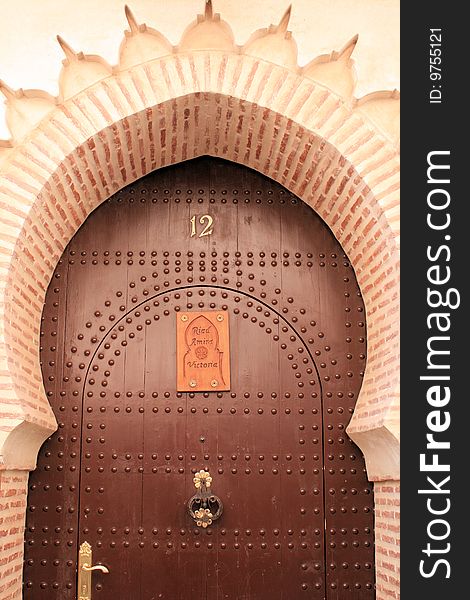 Arch and door in street in Marrakech