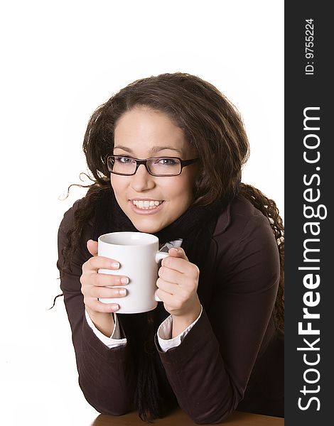 Smiling young beautiful girl with a cup in her hand, on white background.