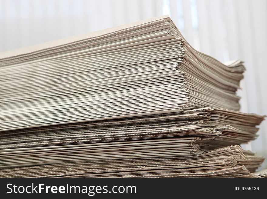 Greater pack of newspapers on a table. Greater pack of newspapers on a table