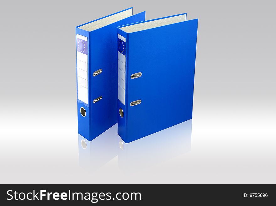 Two blue folders on gray background.