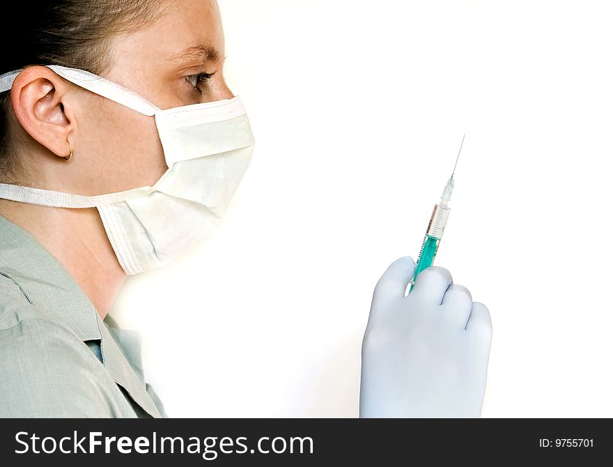 Female doctor with syringe in hand