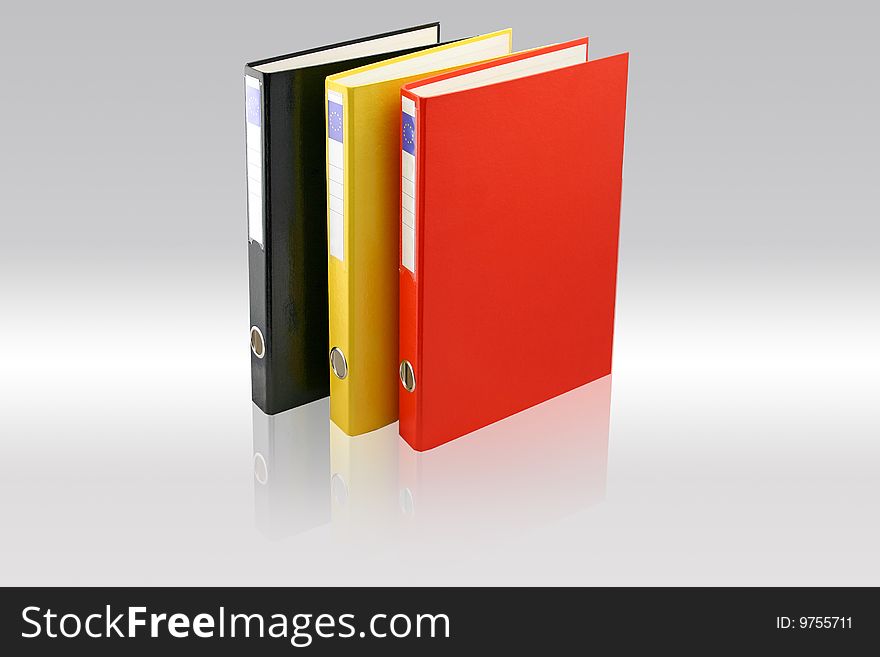 Three business folders on Gray background. Black, yellow and red colors. File with paths.