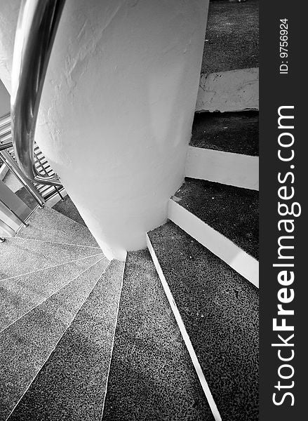 Steps of a spiral staircase in black and white