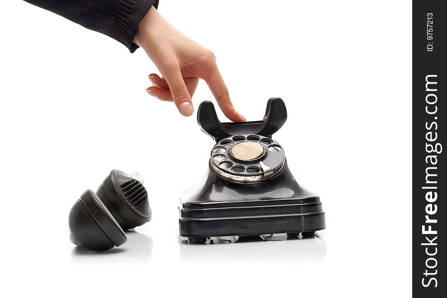 Ending communication on a vintage black telephone. Ending communication on a vintage black telephone