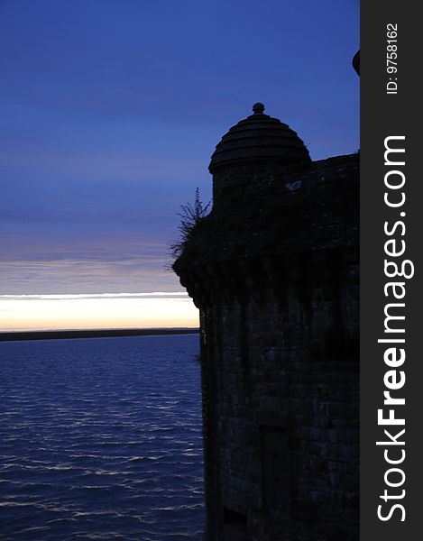 Shadow shape of old castle after sunset