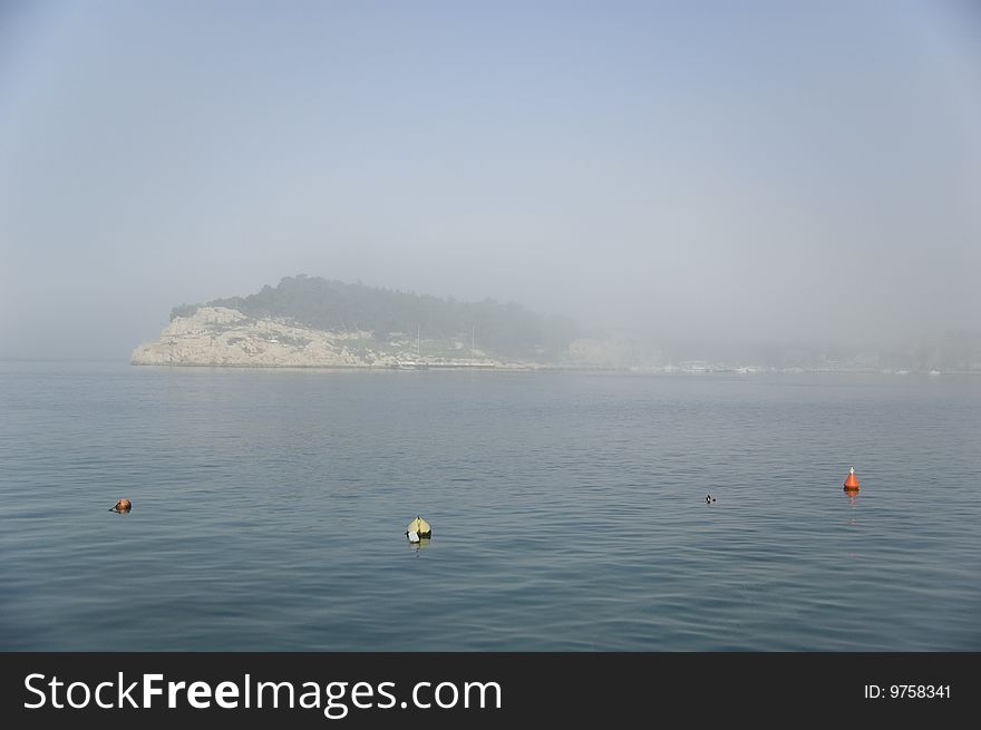 Morning fog on the sea. A foggy morning in Makarska, Croatia. Morning fog on the sea. A foggy morning in Makarska, Croatia.