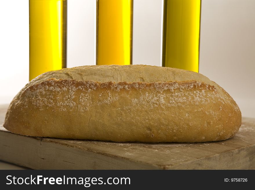 Italian artisan bread on cutting board with eggs and wine. Italian artisan bread on cutting board with eggs and wine.