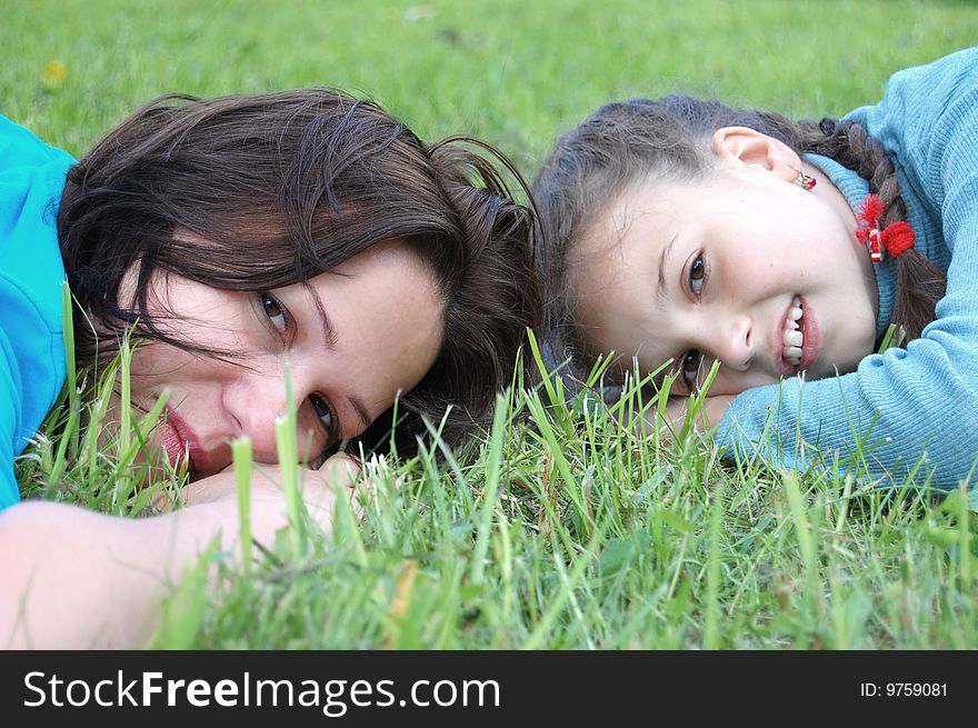 Mother resting outdoor with daughter