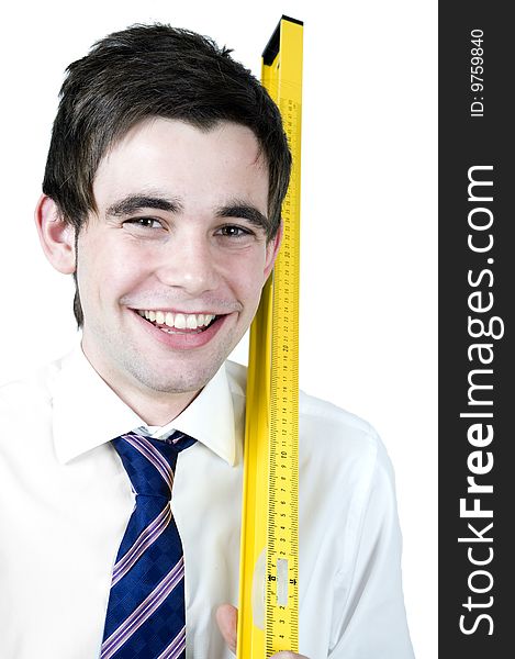 Young office worker holds a yellow ruler. Young office worker holds a yellow ruler