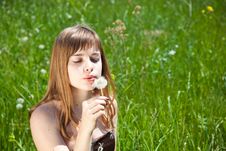 Young Girl Blowing On Dandelion Royalty Free Stock Photo