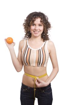 Smiling Fit Woman With Measure Tape And Orange. Stock Images Smiling Fit Woman With Measure Tape And Orange. Stock Images