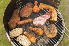 Sausages, Beef And Other Meat On A Barbecue Stock Photos Sausages, Beef And Other Meat On A Barbecue Stock Photos