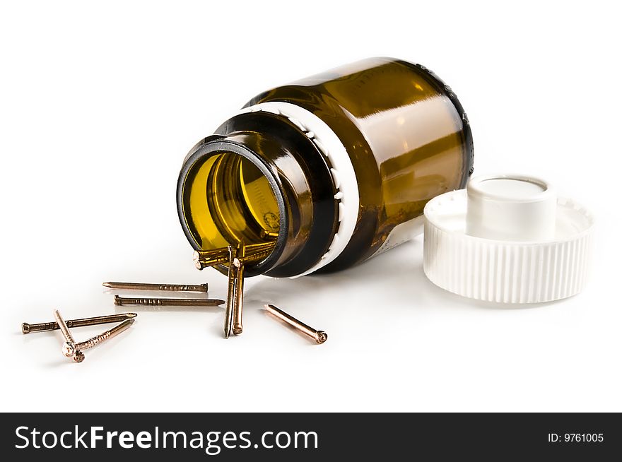 Copper Nails In A Small Jar Isolated On White