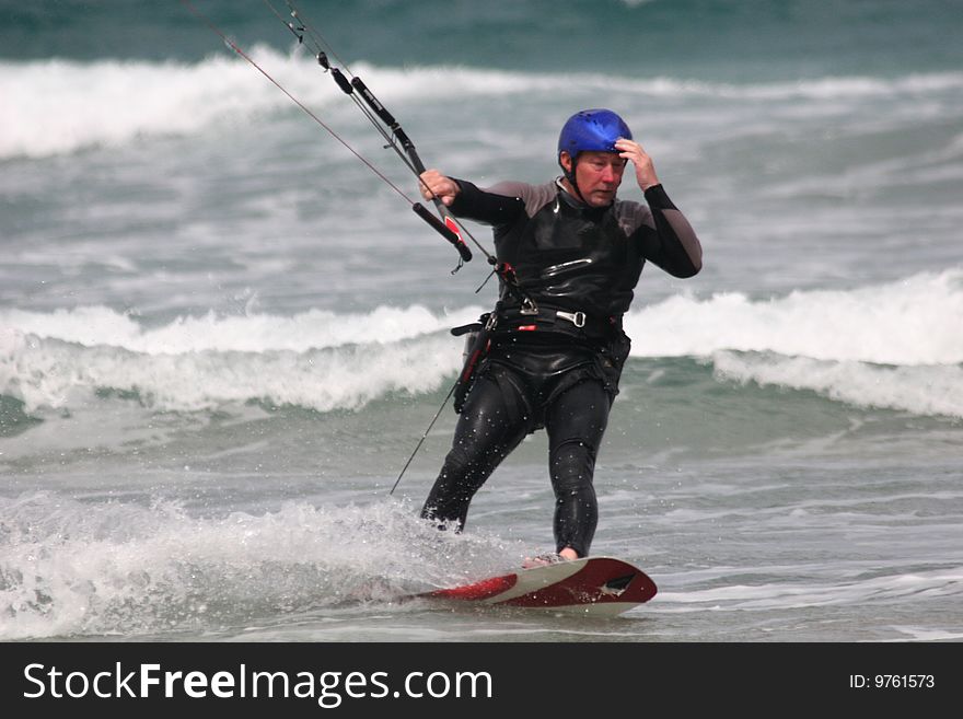Kitesurfer surfing on the waves