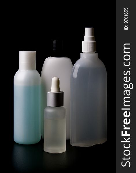 Set of perfumery on black background