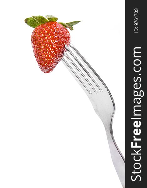 Fork and fresh strawberry isolated on white background