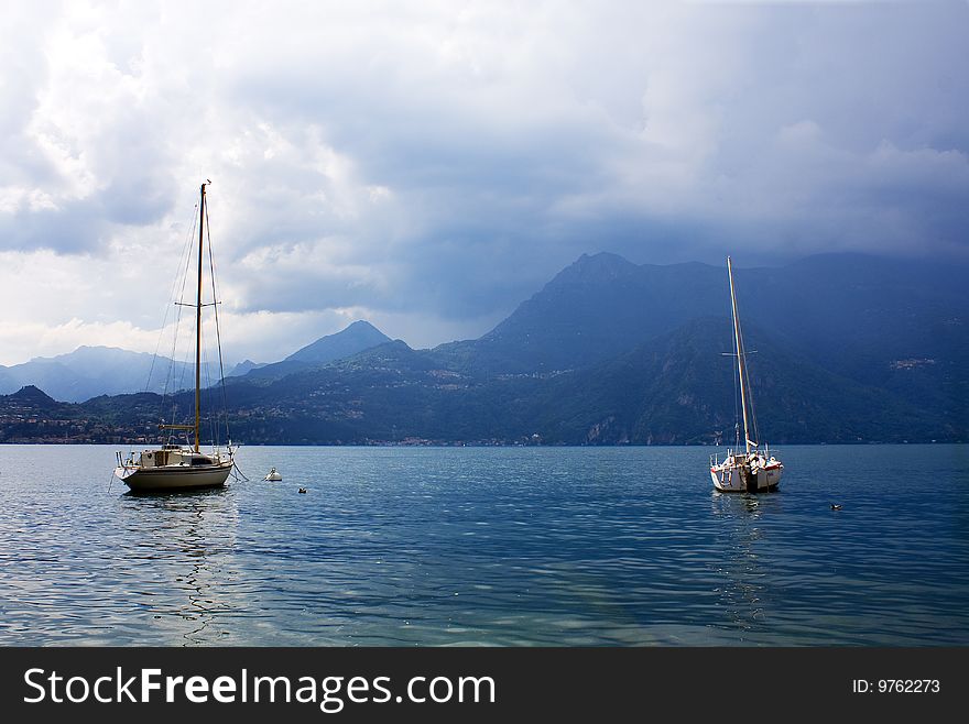 Boats on the lake with stormy sky