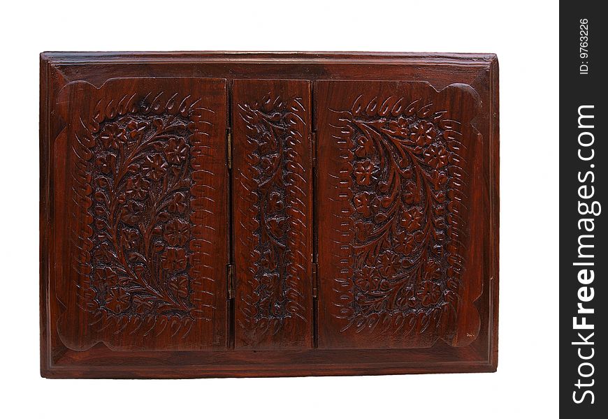 Top view of decorative floral pattern brown colored wooden chest box for storing items like books, jewelry, & other small items. Top view of decorative floral pattern brown colored wooden chest box for storing items like books, jewelry, & other small items.