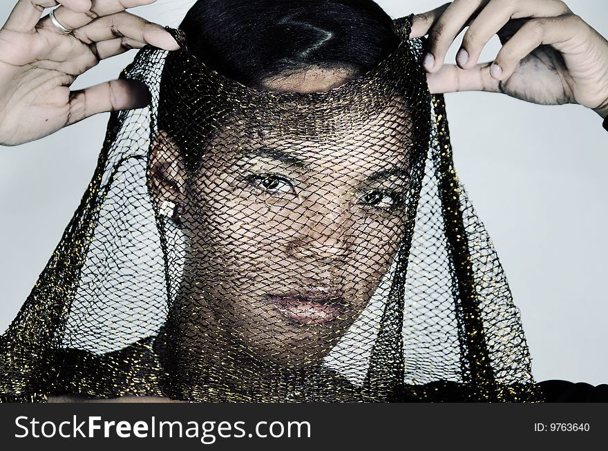 Portrait of young serious african american fashion female with veil. Portrait of young serious african american fashion female with veil