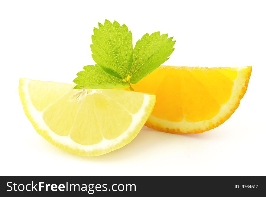 Lobule of lemon and orange with leaves. Lobule of lemon and orange with leaves