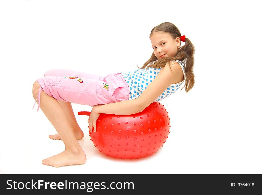 Beautiful young girl with ball exercising