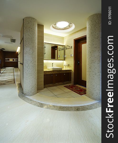 Modern home or apartment area with sink and marble pillars. Modern home or apartment area with sink and marble pillars.