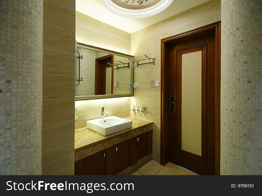 Modern room with sink and tile walls. Modern room with sink and tile walls.