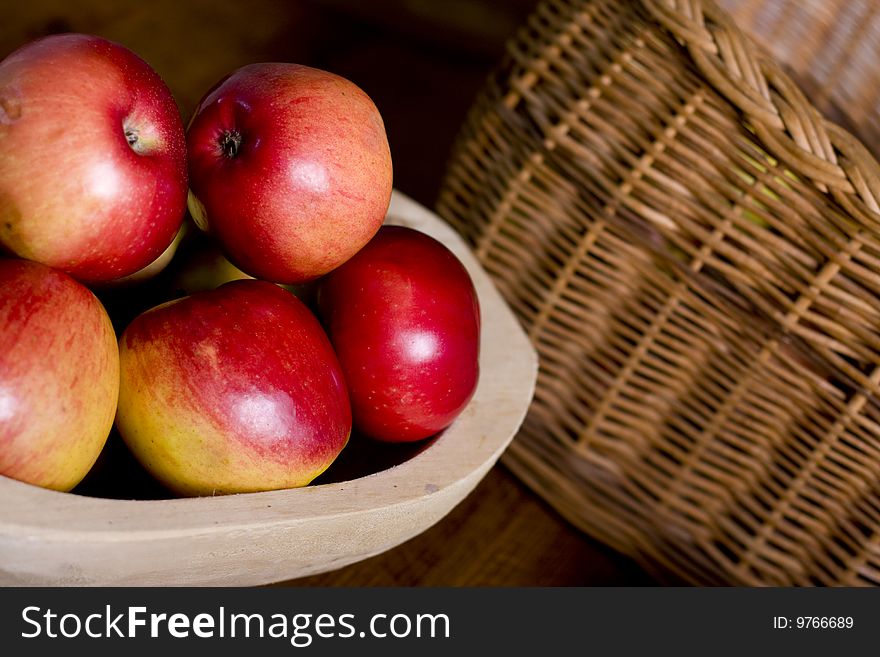 Wooden pan full of apples in kitchen. Wooden pan full of apples in kitchen