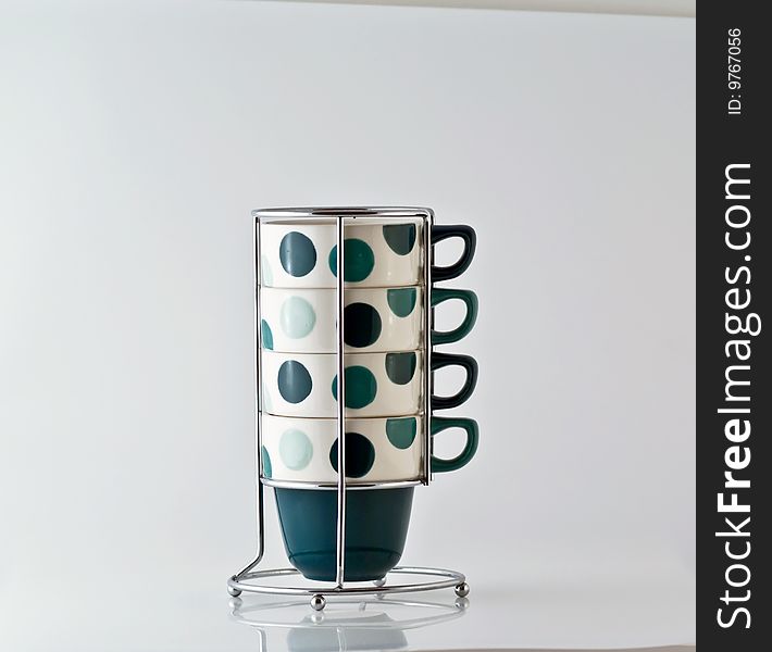 Four Mugs on a steel vertical stand. Four Mugs on a steel vertical stand