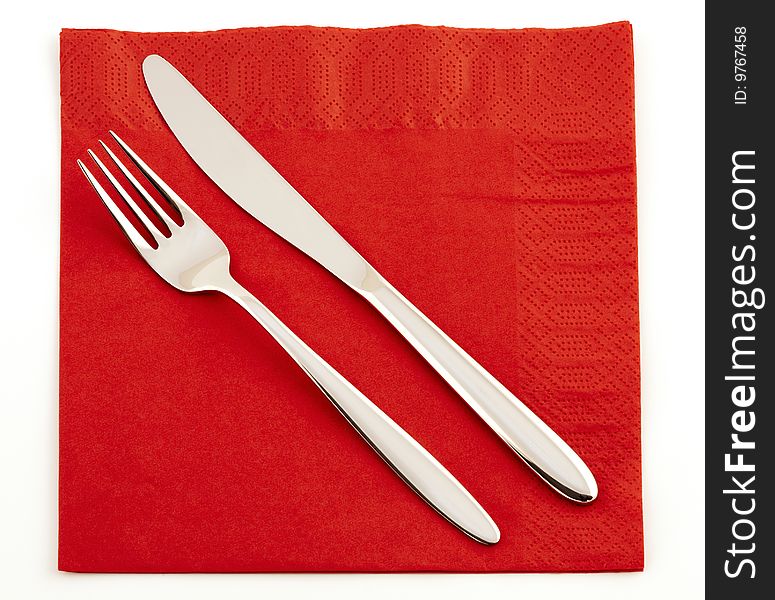 Fork and knife on a red napkin