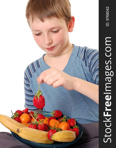 Beautiful boy showing the plate with fruits isolated on white. Beautiful boy showing the plate with fruits isolated on white.