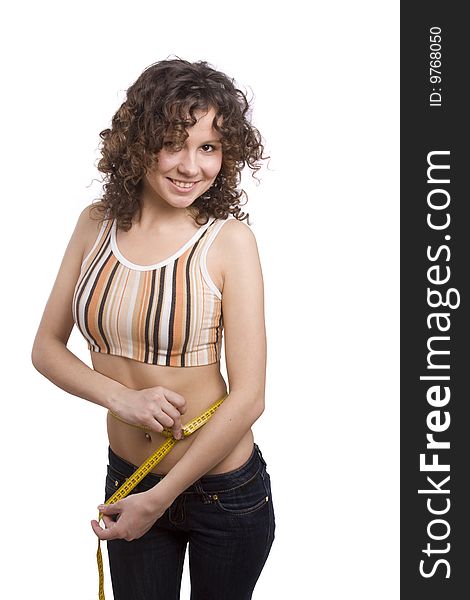 Beautiful fit woman with measure tape isolated over white. Weight loss and healthy lifestyle concept. Girl measuring waist with a tape measure. Isolated. Beautiful fit woman with measure tape isolated over white. Weight loss and healthy lifestyle concept. Girl measuring waist with a tape measure. Isolated