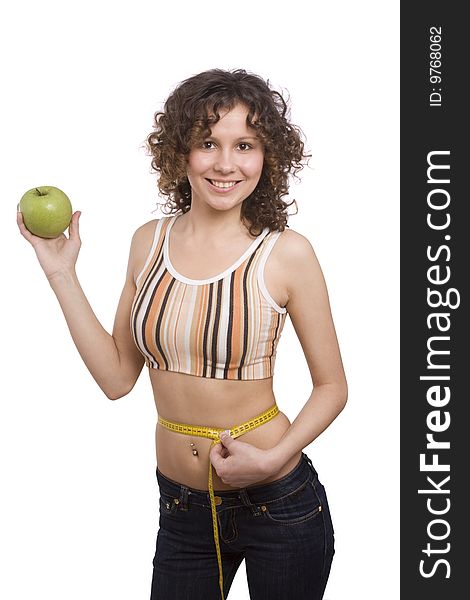 Beautiful fit woman with measure tape isolated over white. Weight loss and healthy lifestyle concept. Girl measuring waist with a tape measure. Isolated. Woman hold apple in hand. Beautiful fit woman with measure tape isolated over white. Weight loss and healthy lifestyle concept. Girl measuring waist with a tape measure. Isolated. Woman hold apple in hand