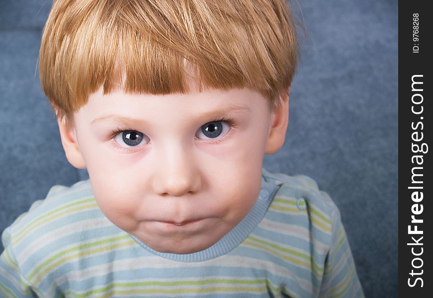 Portrait of the blond little boy on a background. Portrait of the blond little boy on a background