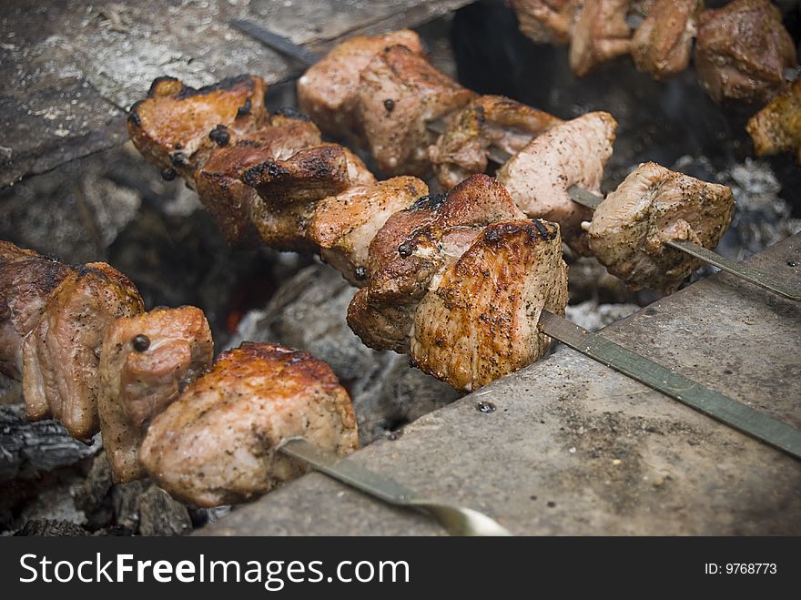 Shish kebab roasting on an open fire