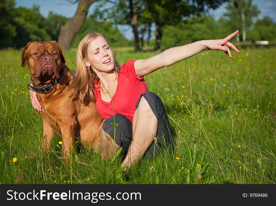 Young girl and her dog (French mastiff, Dogue de Bordeaux)
