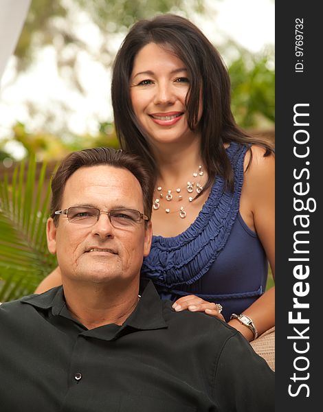 Happy Attractive Hispanic and Caucasian Couple Portrait.