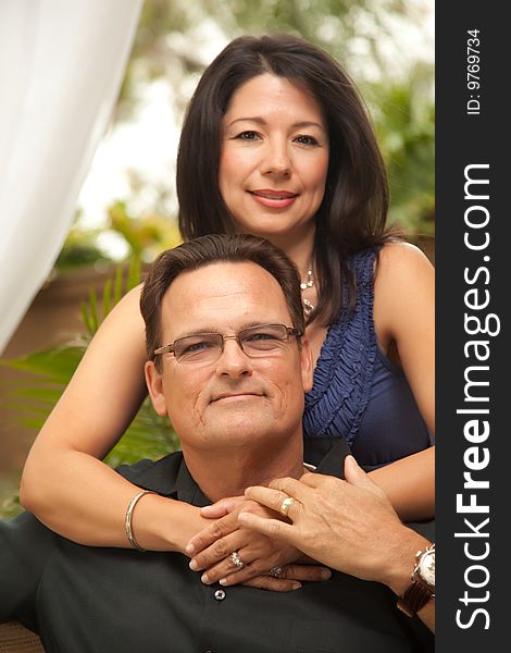 Happy Attractive Hispanic and Caucasian Couple Portrait.