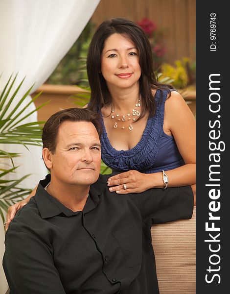 Happy Attractive Hispanic and Caucasian Couple Portrait.