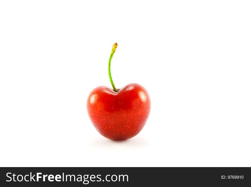 Single red cherry on a white background with clipping path