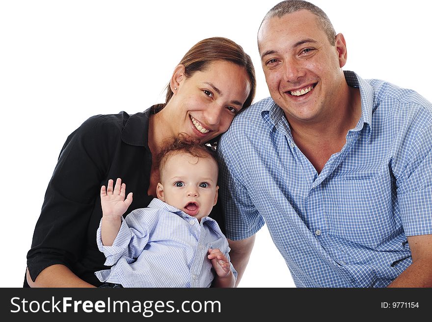 A lovely young family having fun in the studio, isolated on white. A lovely young family having fun in the studio, isolated on white.