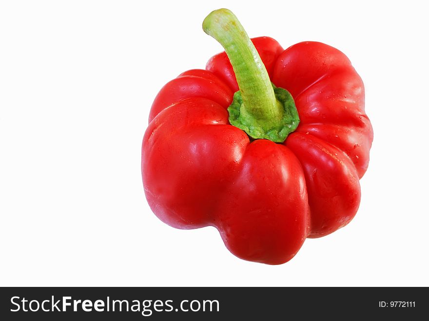 Bright red pepper over white