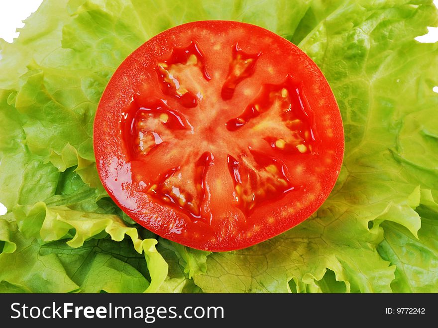 Bright red tomato on lettuce