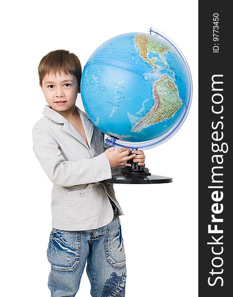 A 6 y.o. boy with a globe isolated on white