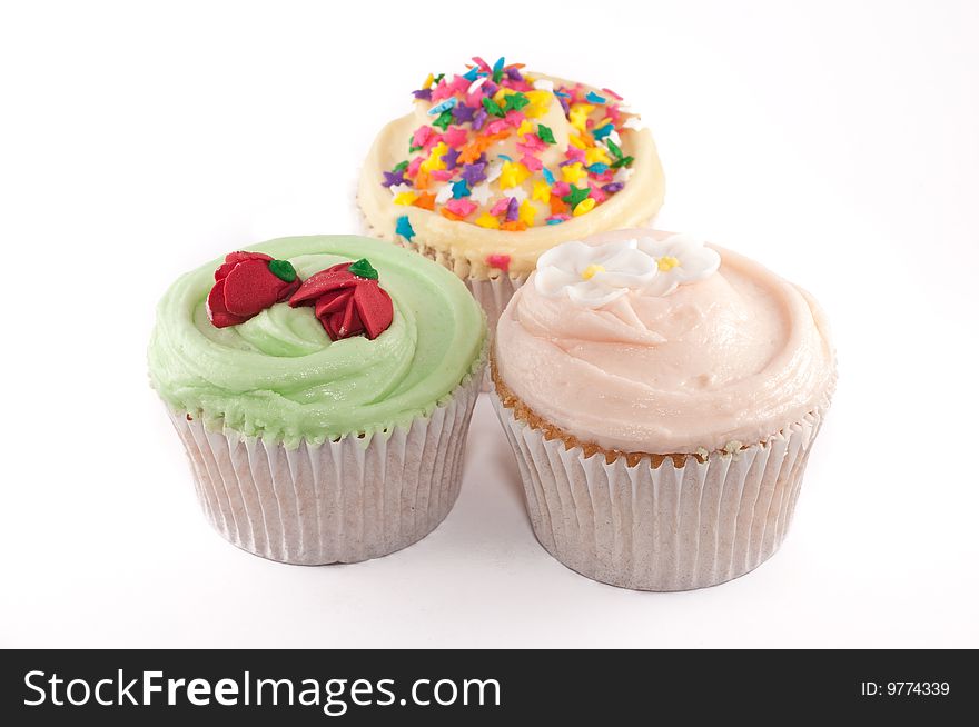 A small group of cupcakes isolated on a white background
