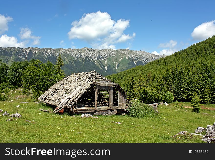Old house on mountain plateau in Carpathian mountains