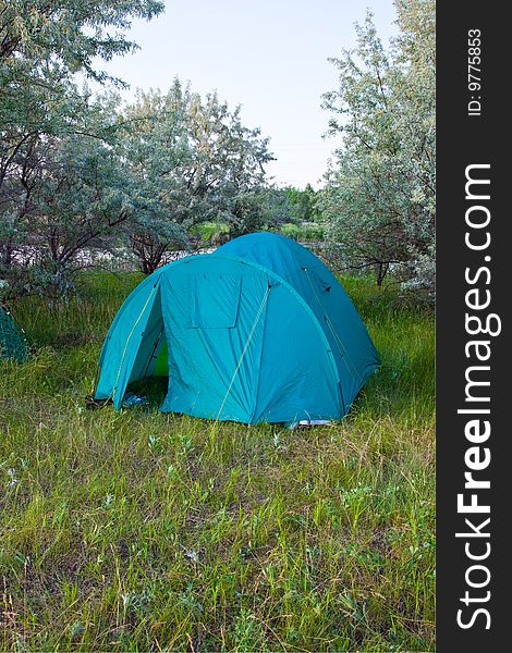 Tourist tent on a clearing in wood