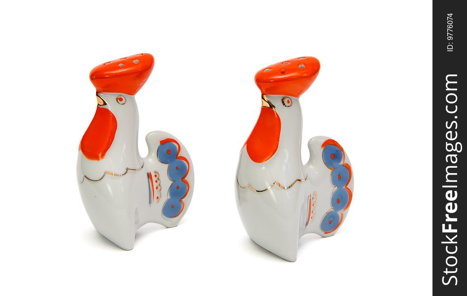 Porcelain rooster saltsellars isolated