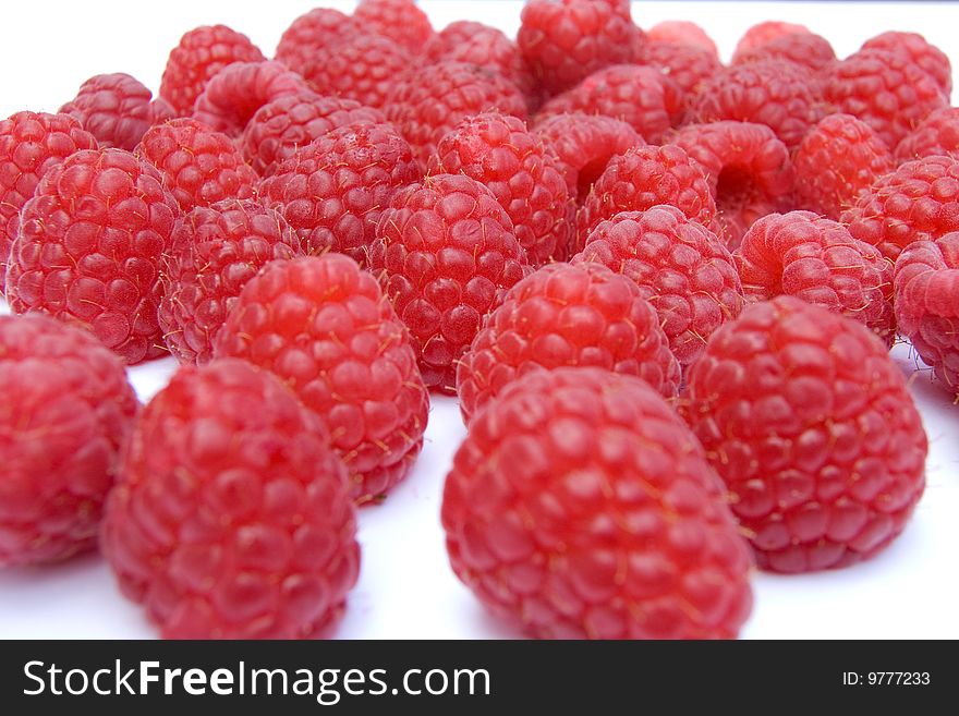 Frontal shot of Raspberries on white background. Frontal shot of Raspberries on white background