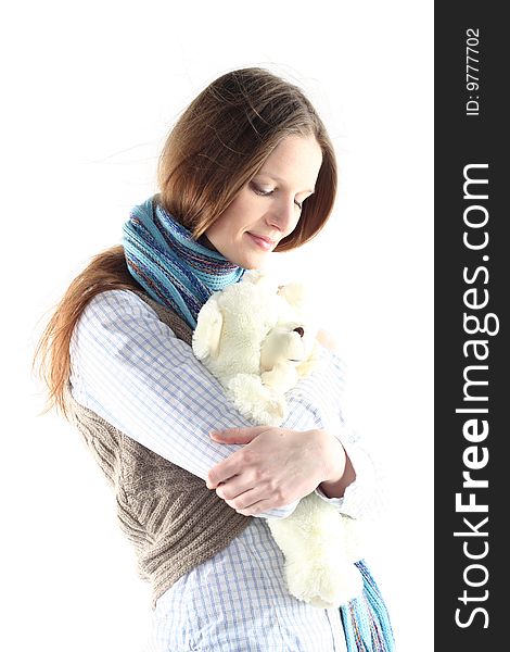 Portrait of young woman with teddy bear isolated on white background